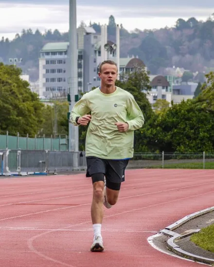 Alex Price, Ultra Distance Runner, running on the track